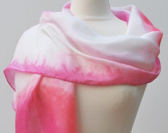 Hand painted silk scarf.  Magenta and soft pink on white background.