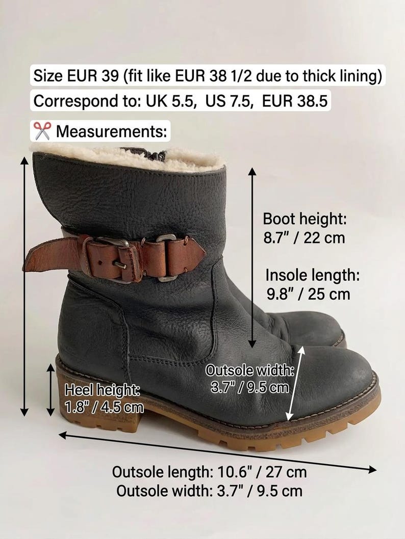May include: A black leather ankle boot with a brown buckled strap and cream-coloured lining. Text indicates size EUR 39, boot height 22 cm, insole length 25 cm, heel height 4.5 cm, and outsole length 27 cm with a 9.5 cm outsole width.