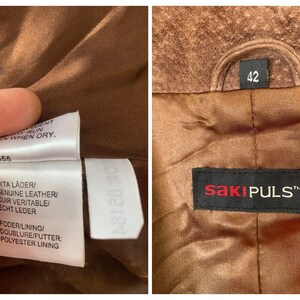 May include: Brown leather jacket with a brown lining and a black label that says "SAKIPULS&trade;". The jacket has a size tag that says "42".