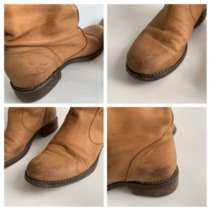 May include: A pair of brown leather ankle boots with a slouchy design. The boots have a rounded toe and a low heel. The leather is distressed and has a worn look.