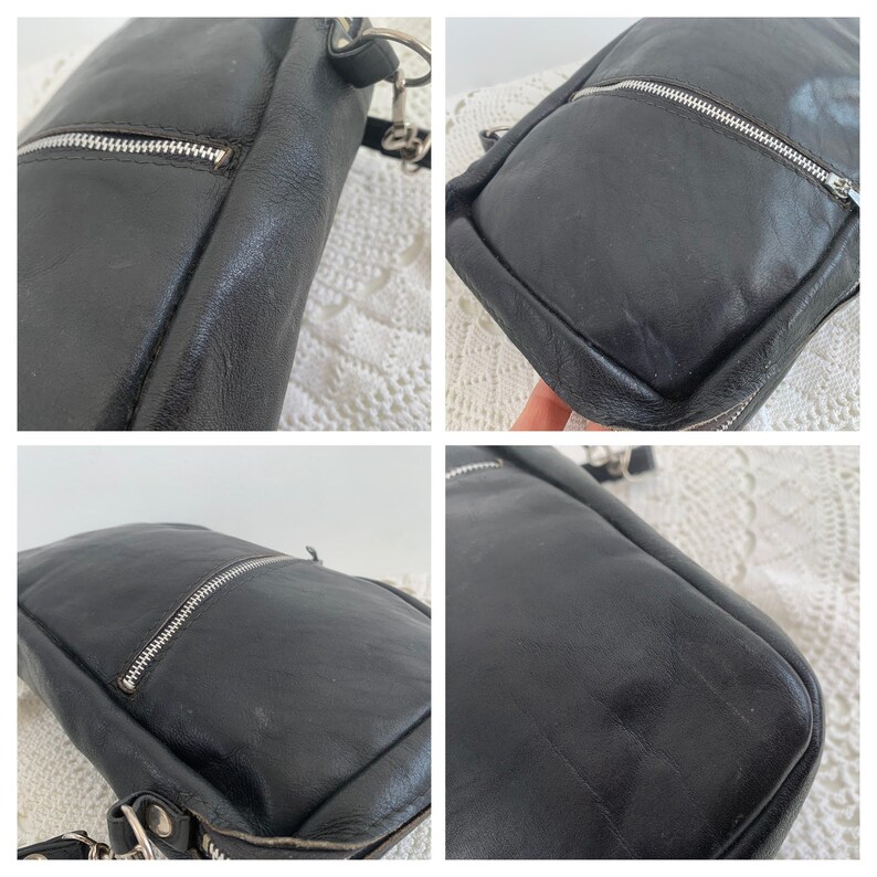 Pu&ograve; includere: Una borsa a tracolla in pelle nera con una cerniera argentata e una tracolla a catena argentata.