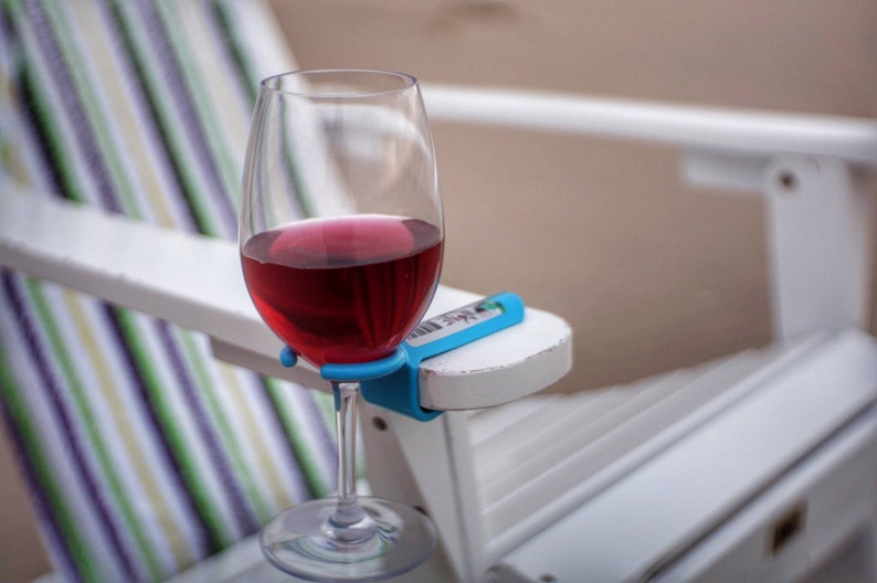 Wine glass holder for an outdoor chair. Works on most Patio, Beach, Camp/Bag chairs! Great Christmas gift!  Makes YOUR chair a better chair! 