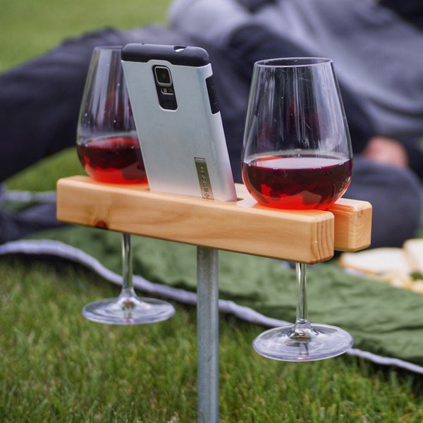 Wine Glass Holder, Smartphone Dock/Speaker. Works w/ most smartphones including iPhone and galaxy.  Gift!  Perfect for picnics!