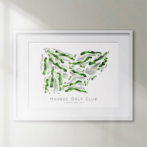 May include: A white framed print of a golf course layout with green and white colours. The print reads "Monroe Golf Club, Rochester, New York".