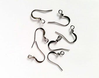 May include: An assortment of silver-colored earring hooks, displayed against a white background. The hooks are curved with a small ball at the end of the hook. The hooks are designed for jewelry making.
