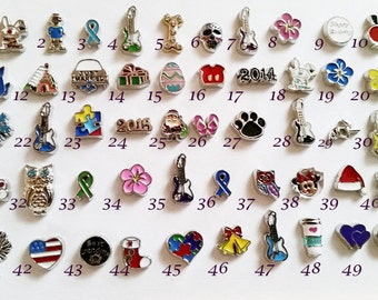 May include: Fifty charm beads for a charm bracelet, necklace, or other jewelry. The charms are silver-toned and feature a variety of designs, including animals, musical instruments, flowers, and holiday themes.