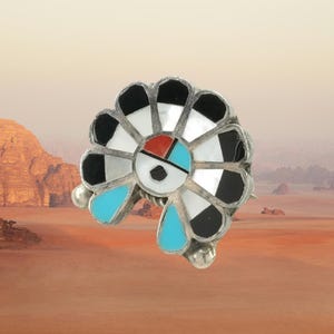 Broche colgante de plata de ley Zuni con incrustaciones de turquesa, nácar, ónix y coral.
