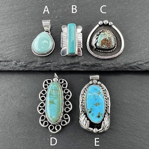May include: Five turquoise pendants with silver settings. The pendants are labeled A, B, C, D, and E. The pendants are all different shapes and sizes.