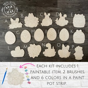 May include: A set of 16 unfinished wooden Easter-themed shapes, including bunnies, chicks, eggs, and baskets. Each shape is labeled with a letter from A to P. The text "EACH KIT INCLUDES 1 PAINTABLE ITEM, 2 BRUSHES, AND 6 COLORS IN A PAINT POT STRIP." is visible at the bottom of the image.