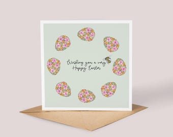 Może przedstawiać: Jasnozielona kartka z życzeniami "Wishing you a very Happy Easter". Kartka jest ozdobiona różowymi i białymi jajkami z kwiatowymi wzorami i małą pszczołą.