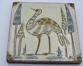 Decorative ceramic tile decorated with the image of a bird, vintage tile, decorative ceramics