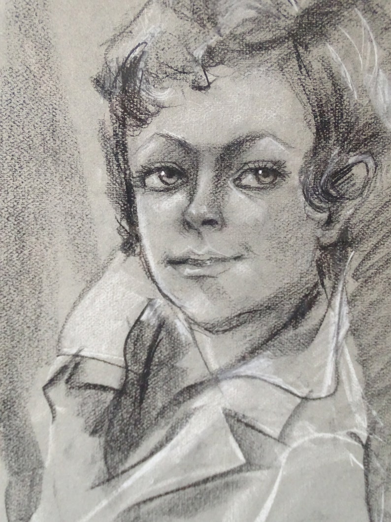May include: A black and white charcoal drawing of a person's face. The person has short, curly hair and is wearing a collared shirt. The drawing is done in a realistic style.