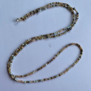 African style waist beads/belly beads/belly chain. All sizes available. Multi coloured creams greens browns with silver plated  clasp.