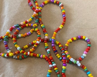 Multi coloured beaded necklace 4mm glass beads. Boho beach hippie love. 56 inches long can double as a bracelet. Colours will be random