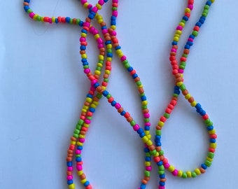 Multi coloured neon beaded necklace 4mm glass beads. Boho beach hippie festival love. 56 inches long can double as a bracelet too.