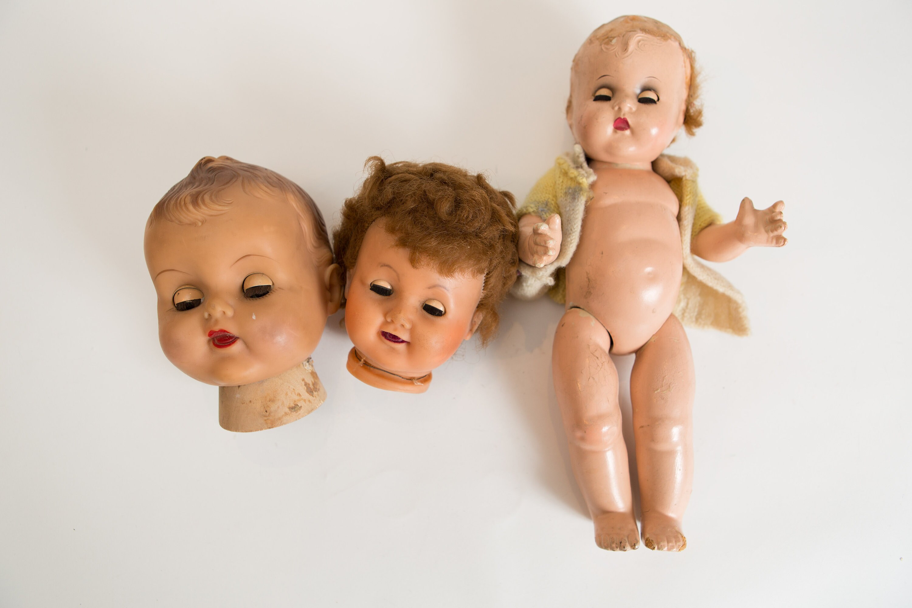 Vintage Doll Heads and Plaster Doll and Sleeping Eyes and Moving Arms