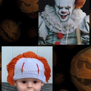 May include: A white crocheted hat with orange yarn hair and red stitches, resembling the character Pennywise from the movie IT. The hat is on a mannequin head.