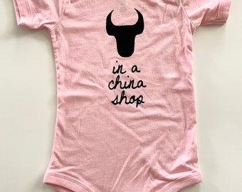 Bull In A China Shop, size: 6-12 months, Durham Baby one-piece, romper light pink with Black print