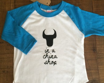 Bull In A China Shop,  Baseball Tee -American Apparel, Size 6T, Teal Baseball Tee with Black print