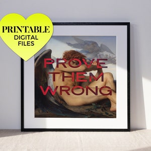 May include: A framed print of a painting of a winged figure with the text "PROVE THEM WRONG" superimposed on the image.