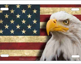 May include: A vintage-style American flag with a bald eagle head in the right corner. The flag has a distressed look with faded colors and a textured surface.
