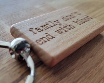 Family Don't End With Blood - Laser Engraved Wooden Keychain