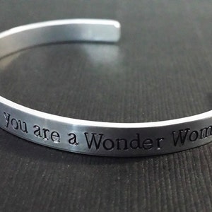 In a world of ordinary mortals, you are a Wonder Woman Hand Stamped Aluminum Bracelet Cuff image 3