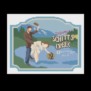 May include: Cross-stitch design featuring a scene from Schitt's Creek. The image shows two figures in a lake, with the text "Welcome to Schitt's Creek" and "Where everyone fits in". The design uses a pixelated style.