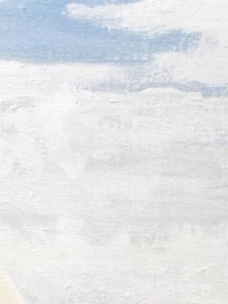 May include: Abstract art piece with a textured, white surface and patches of light blue, resembling a cloudy sky. The artwork has a rough, painted appearance, with the text "MarshVioletDesigns" subtly visible.