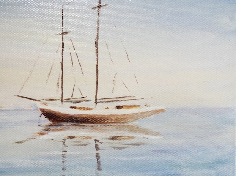 May include: A white sailboat with brown masts and sails is anchored in calm, blue water. The sky is a light blue with a hint of white clouds.
