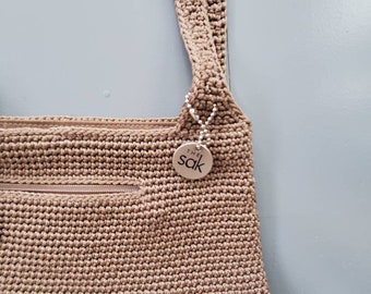 The Sak crochet shoulder bag 90 s vintage dark tan metal hang tags top zip 3 compartments The Sak bag
