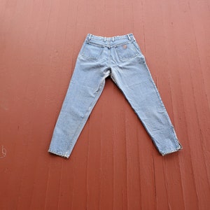 Vintage 90&#39;s Guess jeans high waist tapered zip leg mom jeans Patched upper inner thigh with fraying seams Size 31 ankle length light wash