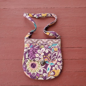 Vera Bradley top zip crossbody purse quilted front magnetic closure pocket for compartments floral pattern purple gold green pink some wear
