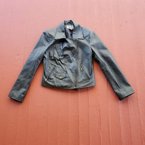 Clio Leather Motorcycle jacket 80&#39;s vinage size 12 modern size medium black leather moto jacket side zip lined great condition