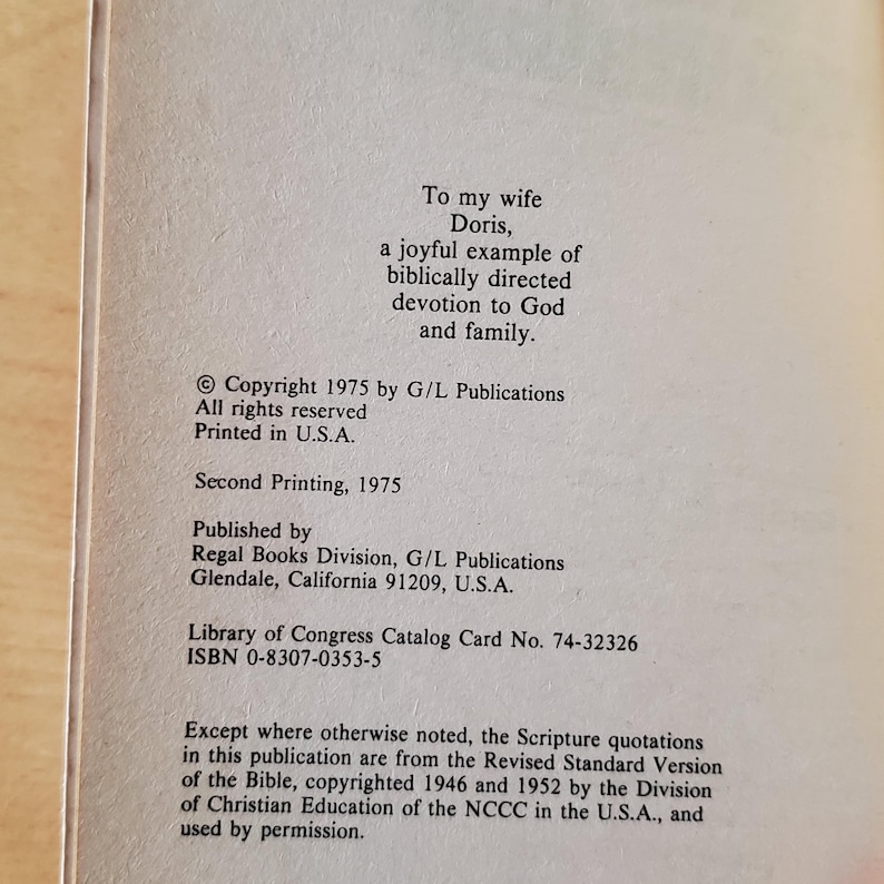 May include: Cream-colored book page with text. The text includes a dedication to Doris, copyright information from 1975, and publishing details from Regal Books Division, Glendale, California. The ISBN is 0-8307-0353-5.