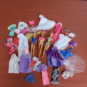 3 vintage Barbie Dolls 2 from 1966 era and 1 from 1995 plus 23 pieces of clothing some genuine Barbie or Skipper clothing Barbie doll