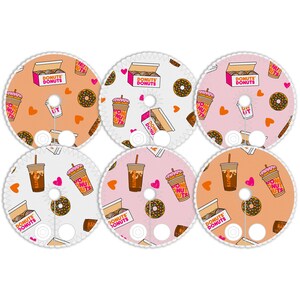 May include: Six round stickers with a donut shop theme. The stickers feature a pink and white background with images of donuts, coffee, and hearts. The text "Donuts Donuts" is featured on the stickers.
