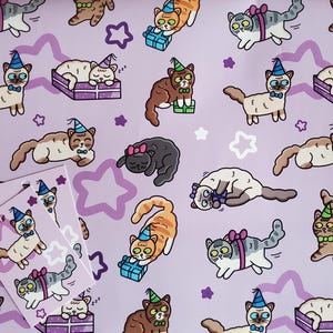 May include: Lilac wrapping paper and gift tags with a repeating pattern of cartoon cats in party hats and bow ties. The cats are depicted with gifts, sleeping, or playing. White stars and purple star shapes are also included in the design.
