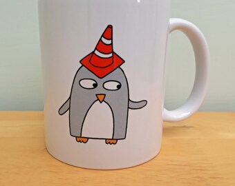 Funny Penguin Ceramic Mug: Scottish Cone on Head Design