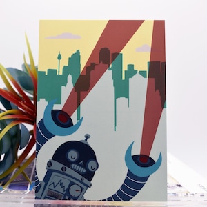 May include: A set of three ceramic mugs with a speckled, matte finish. The mugs are in shades of cream, light gray, and dark gray. Each mug has a simple, minimalist design, perfect for coffee or tea.