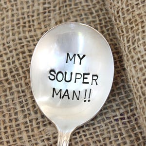 May include: A silver spoon with the words "My Souper Man!!" engraved on the front.