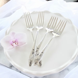 May include: Four silver forks with engraved text, "Miss", "Mr.", "I Do", and "Me Too", and the date "6-24-2023".