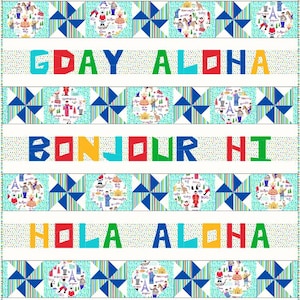 Puede incluir: Un panel de tela colorido con frases como "HELLO CIAO" y "G'DAY ALOHA" en varios colores brillantes. El diseño incluye ilustraciones circulares de personas y monumentos, con patrones geométricos azules y verdes.