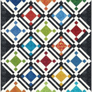 May include: A colorful quilt featuring a repeating diamond pattern. Each diamond is framed by black and white stripes and contains a smaller diamond in various colors, including blue, red, green, and orange. The background is a dark, textured fabric.