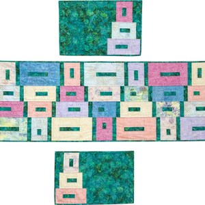 May include: A patchwork quilt with a geometric design of rectangular blocks in pastel shades. The blocks are arranged on a teal background. The quilt's design includes pink, blue, yellow, and purple blocks, creating a vibrant textile.