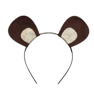 May include: A brown bear ear headband with a black plastic band. The ears are made of brown felt with a light tan inner ear. This costume accessory is perfect for themed parties or dress-up.