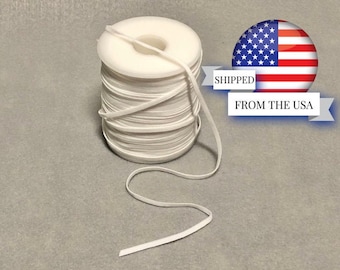 May include: A spool of white elastic cord, approximately 1/8 inch wide, with a length of 10 yards. The cord is wound around a white plastic spool. The spool is sitting on a gray surface.  Shipped from the USA.