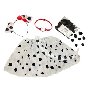 May include: Dalmatian dog costume set for kids, featuring a white tulle skirt with black polka dots, a red headband with black ears, a red collar with a heart charm, and a black felt tail.