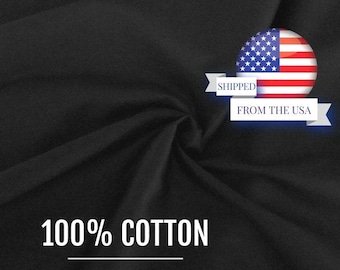 May include: A solid black fabric with a soft, draped texture. The image features a circular graphic of the United States flag with a white banner containing the text SHIPPED FROM THE USA. The text 100% COTTON is printed in white at the bottom.