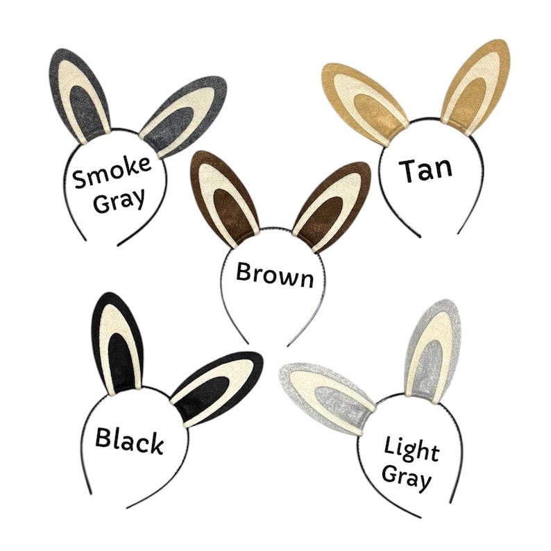 Puede incluir: Cinco diademas de orejas de conejo en varios colores: gris humo, marr&oacute;n claro, marr&oacute;n, negro y gris claro. Cada diadema tiene una fina montura de alambre negro y el nombre del color impreso en un c&iacute;rculo blanco.